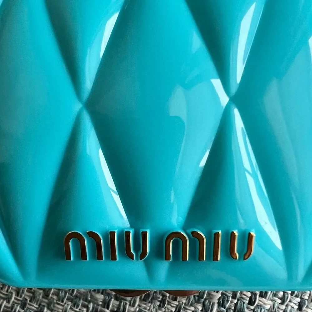 39. Miu Miu Turquoise Compact Case